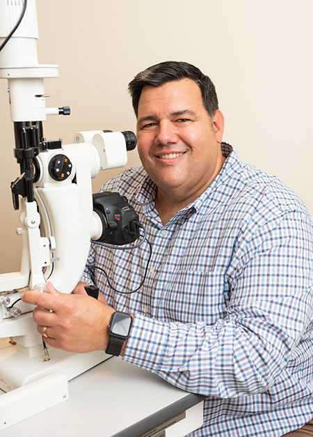 dr joseph hegyi using slit lamp during eye exam