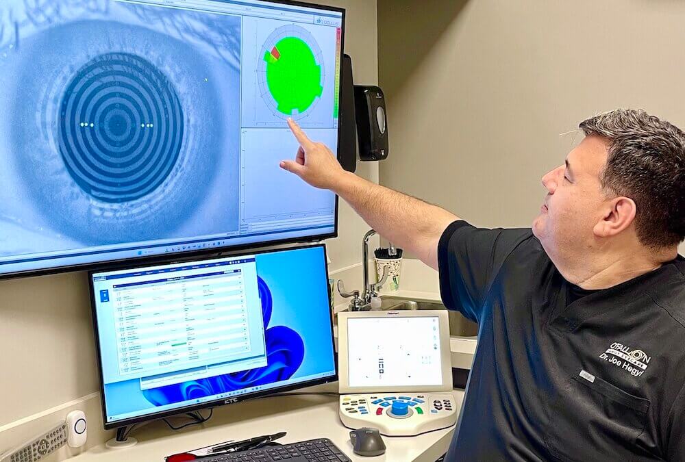 Dr Joe Hegyi explaining the results of a tear breakup time test.